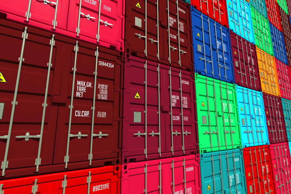 Stacked Colorful Cargo Containers.  Industrial and Transportation Background.